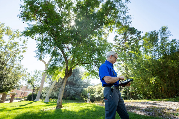 Landscape supervisor Mark Jones using a tablet