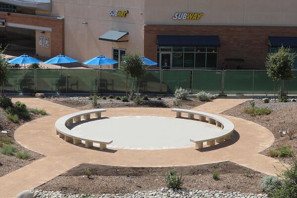 Round pathway with drought-tolerant plants around it