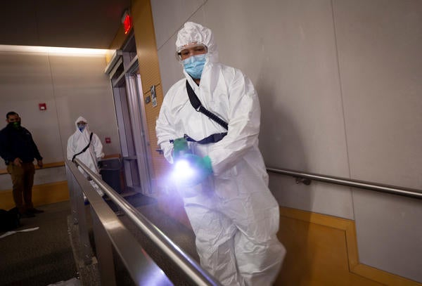 Robert Felder, with Facilities Services tries out an electrostatic sprayer on a railing during a training exercise on Wednesday, March 3, 2021, at UC Riverside. (UCR/Stan Lim)