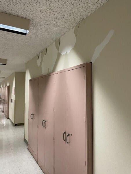 Wall paint cracking above lockers