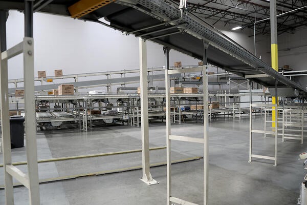 Conveyor belts moving paper products in a factory