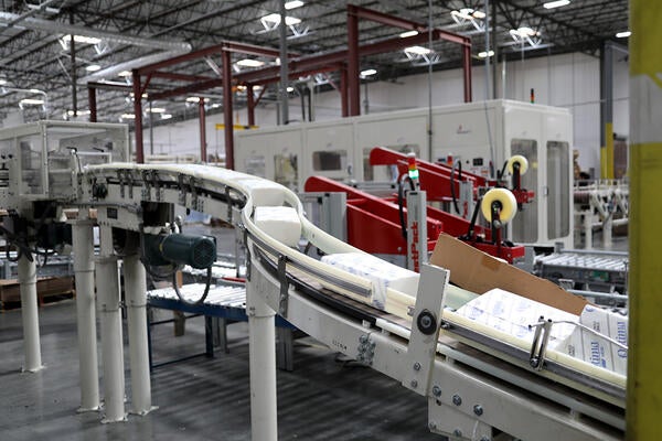 Multifold towels on an assembly line